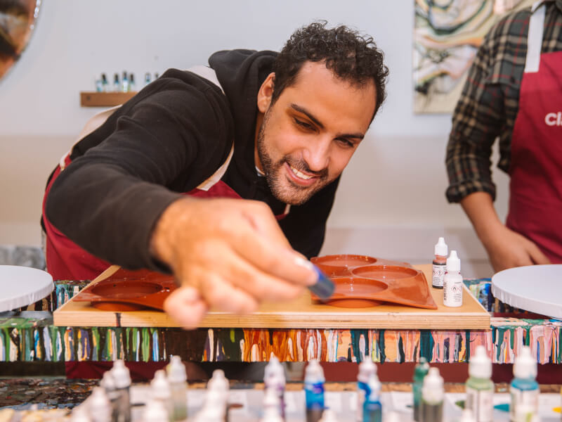 A man enjoying his experience gift art class